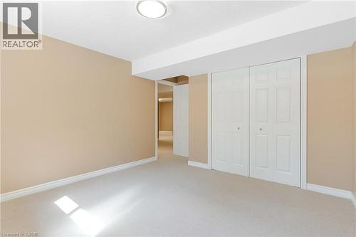 Light-colored wall-to-wall carpeting throughout - 227 Chestnut Hill Crescent, Kitchener, ON - Indoor Photo Showing Other Room