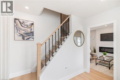 Entryway with light wood-finish flooring, white trim, and recessed lighting - 297 Britannia Avenue, Hamilton, ON 