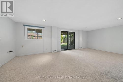 Rec-room with walk out to yard - 72 Bonacres Avenue, Toronto, ON 