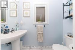 MAIN FLOOR POWDER ROOM - 