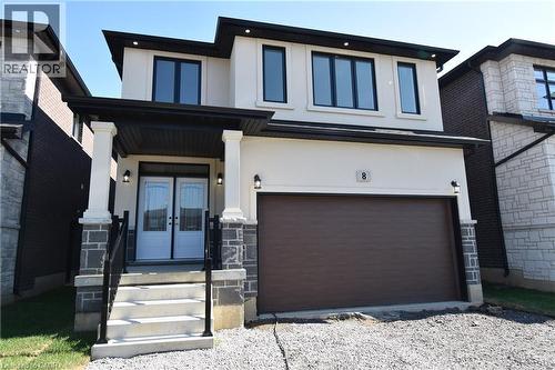 Contemporary two-story residence featuring a white stucco exterior with dark trim accents - 8 Dunlop Road, Hamilton, ON - Outdoor