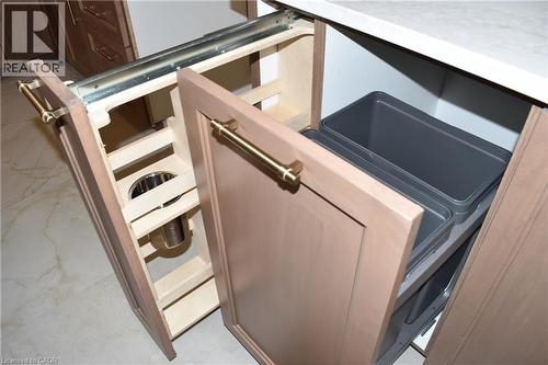 Integrated pull-out storage solutions featuring light wood-finish cabinetry, brushed brass hardware - 8 Dunlop Road, Hamilton, ON - Indoor Photo Showing Kitchen