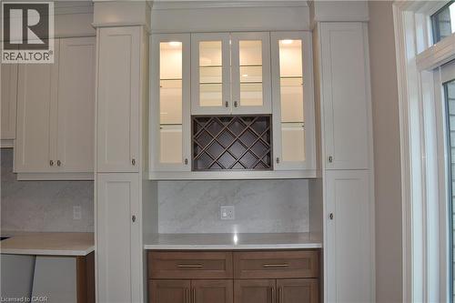 Servery area in dinette with wine rack and glass display cabinets. - 8 Dunlop Road, Hamilton, ON - Indoor