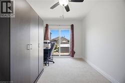 Room with light-toned carpet flooring and white baseboards - 