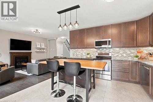 921 Eden Oak Court, Kitchener, ON - Indoor Photo Showing Kitchen With Fireplace With Upgraded Kitchen