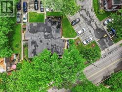 Property features a flat roofline and multiple paved parking areas - 