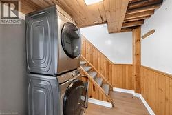 Stacked laundry machines providing functional convenience - 