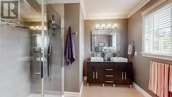 Ensuite with double sinks and walk-in shower. - 