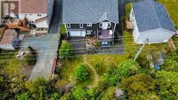 Drive-in access to backyard and second garage. - 