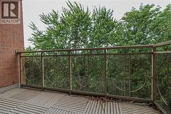 Outdoor balcony with slat-style deck flooring - 