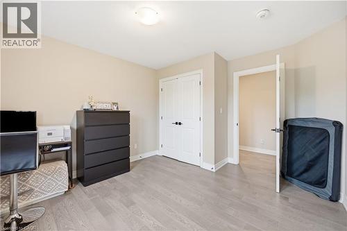Light-toned wood-finish flooring complements neutral wall tones and white trim - 1 Lindsay Way, Grimsby, ON - Indoor