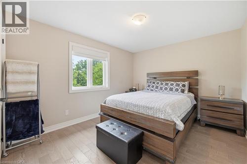 Bedroom featuring light wood-finish flooring and neutral wall tones - 1 Lindsay Way, Grimsby, ON - Indoor Photo Showing Bedroom