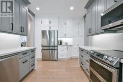 Kitchen w quartz waterfall counters & backsplash - 