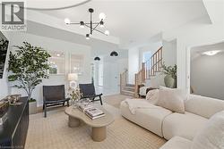 Spacious interior with neutral color palette and wood-finish flooring - 