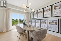 Light wood-finish flooring extending to a spacious outdoor deck with black railings - 
