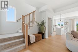 Open concept living space featuring light wood-finish flooring - 