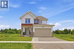 Modern two-story residence featuring a two-car garage, white vertical siding, and warm wood-tone accents - 