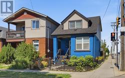 Front -Detached Home featuring a blue brick facade - 
