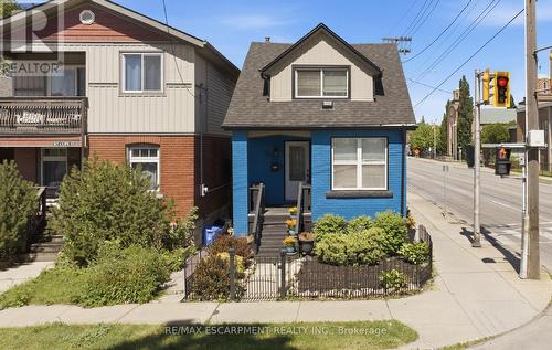Front -Detached Home featuring a blue brick facade - 309 Cope Street, Hamilton, ON - Outdoor With Facade