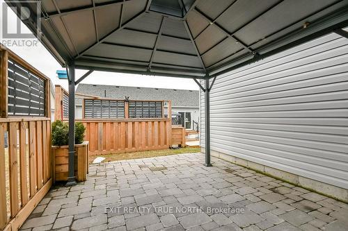 Stone patio with gazebo and privacy fence - 8 Sinclair Crescent, Ramara, ON 
