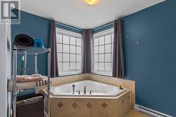 Primary bedroom jacuzzi tub. - 
