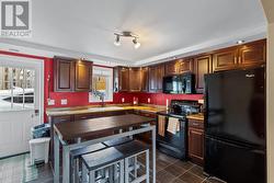 Bright food prep area with access to car park & beautiful back yard. - 