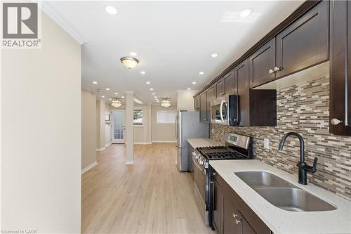 Main Floor Kitchen/Dining & Living areas - 309 Cope Street, Hamilton, ON - Indoor Photo Showing Kitchen With Double Sink With Upgraded Kitchen