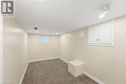 Bedroom/Rec Room Finished room featuring light beige walls, recessed lighting, and carpet flooring - 