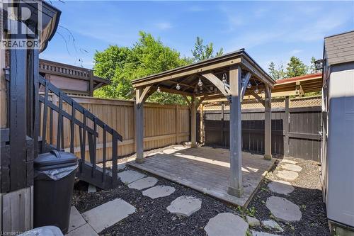 Backyard featuring a wooden gazebo with string lighting over a wood-finish deck - 309 Cope Street, Hamilton, ON - Outdoor