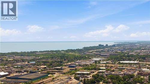 Expansive aerial perspective showcasing a significant body of water bordered by a tree-lined shore - 309 Cope Street, Hamilton, ON - Outdoor With View
