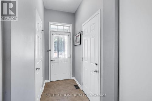 Front Entrance with Garage and Partial Bath - 577 Ashbourne Crescent, Ottawa, ON 