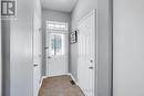 Front Entrance with Garage and Partial Bath - 577 Ashbourne Crescent, Ottawa, ON 