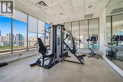 Fitness area with city panoramas through expansive windows - 