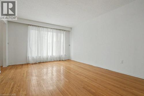 Hardwood flooring throughout, complemented by expansive windows offering natural light - 396 Pinemeadow Avenue, Mississauga, ON 