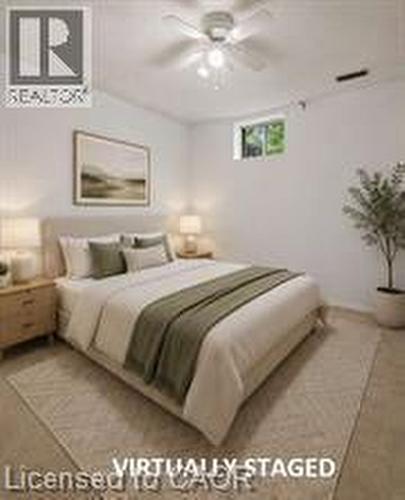 Bedroom featuring light-colored flooring, white walls, and a ceiling fan with integrated lighting - 396 Pinemeadow Avenue, Mississauga, ON 