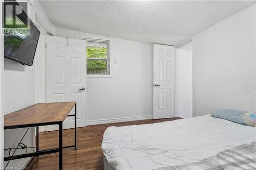 Room featuring light-colored walls and wood-finish flooring - 43 Whitfield Avenue, Hamilton, ON 