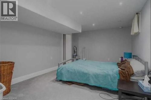 Room featuring light grey painted walls, white baseboards, wall-to-wall carpeting, and recessed ceiling lighting - 98 Brubacher Street, Kitchener, ON 