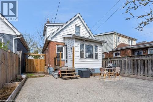 Gravel surfaced yard with perimeter fencing - 22 Cope Street, Hamilton, ON 