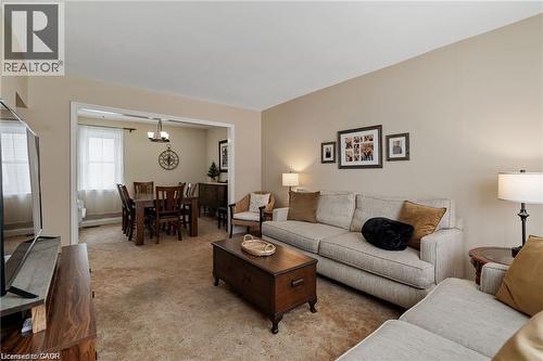 Spacious living area with neutral wall tones and plush carpeting - 2 Mill Street E, York, ON 