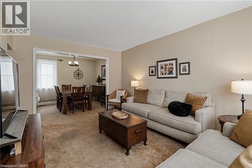 Living area featuring neutral wall paint and plush carpeting - 2 Mill Street E, York, ON 