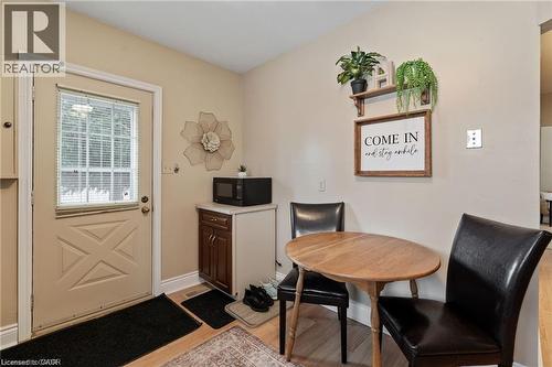 Entry area with a paneled exterior door featuring a window insert - 2 Mill Street E, York, ON 