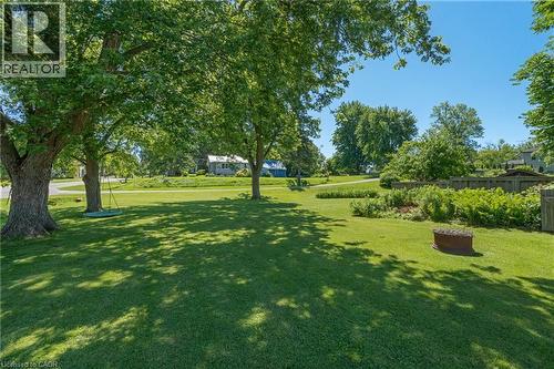 Expansive lawn with mature shade trees and a dedicated garden area - 2 Mill Street E, York, ON 