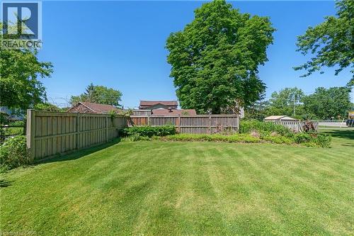 Expansive lawn area with a perimeter wood fence - 2 Mill Street E, York, ON 