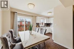 Dining area featuring a sliding glass door leading to an outdoor deck - 