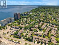 Aerial overview showcasing a waterfront urban landscape with established residential areas - 