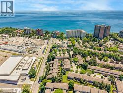 Aerial perspective showcasing a residential community with abundant mature trees - 