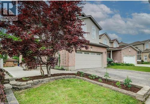 Brick and siding exterior with an attached garage - 59 Highgate Road Unit# 2, Kitchener, ON 