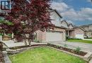 Brick and siding exterior with an attached garage - 59 Highgate Road Unit# 2, Kitchener, ON 