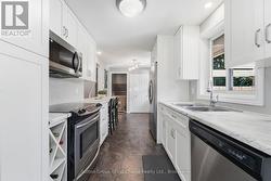 Kitchen view to lower level & to Side Door - 