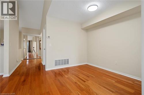 Room featuring wood-finish flooring, neutral wall tones, and recessed lighting - 117 E Bristol Road E Unit# 64, Mississauga, ON 